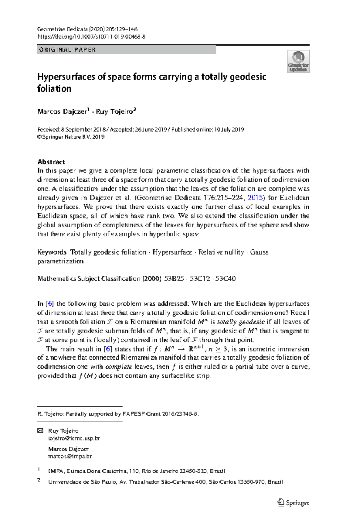 Hypersurfaces of space forms carrying a totally geodesic foliation ...